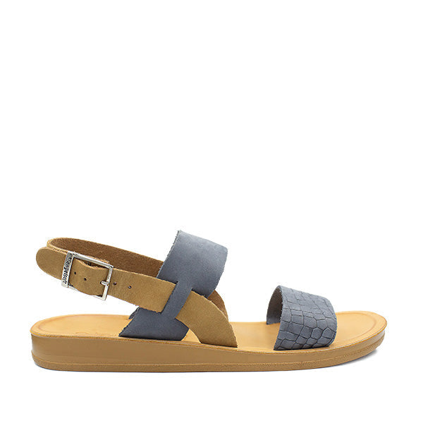 A denim blue Angelsoft Tanya sandal with a brown ankle strap and a polyurethane sole.