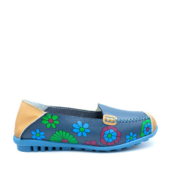 A blue leather shoe with colorful floral patterns and a tan accent on the heel.