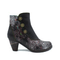 A black leather ankle boot featuring a floral embossed pattern, decorative front buttons, and a chunky heel.