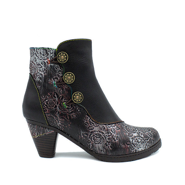 A black leather ankle boot featuring a floral embossed pattern, decorative front buttons, and a chunky heel.