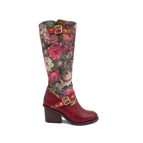 A stylish full-grain leather boot with a floral rose print on the calf section, featuring a full-length zip and decorative buckles.