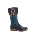 A woman's boot with blue suede and a multicolored fabric on the cuff, featuring a decorative buckle.