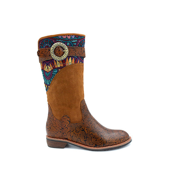 A woman's boot with a brown base and multicolored patterned fabric on the upper part, featuring a decorative buckle.