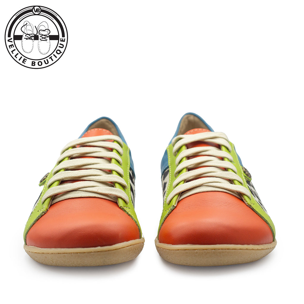 Colorful sneakers with green and orange accents on a white background.