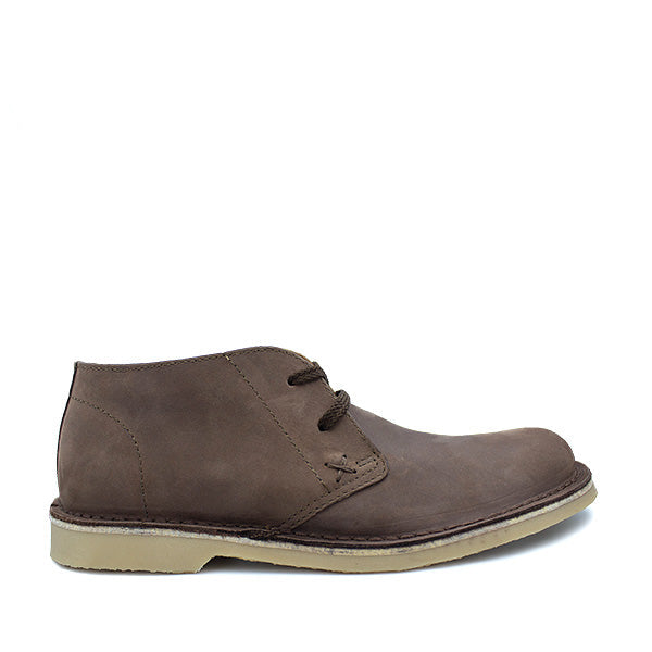 A brown, handcrafted leather lace-up shoe for men, displaying the brand logo at the top.