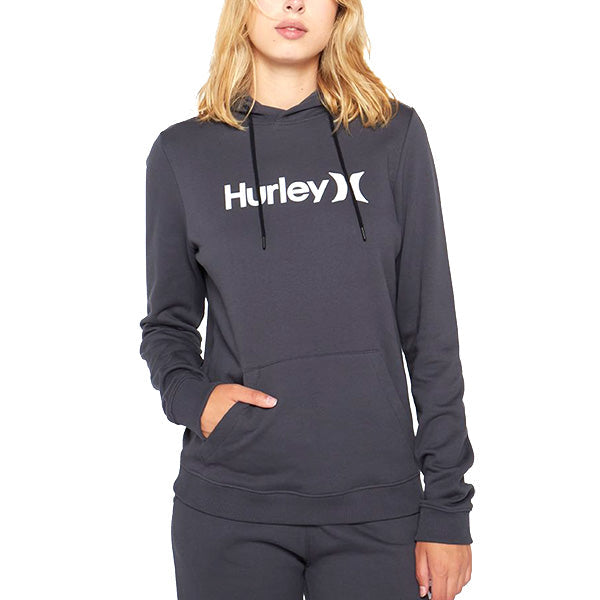 A woman wearing a navy Hurley hoodie with the brand's logo on the front, paired with matching pants.