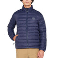A man wearing a navy puffer jacket with long sleeves, branded with 'JEEP' on the chest area.