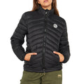 A woman wearing a black Jeep Ladies Core Puff Jacket with a visible brand logo on the chest.