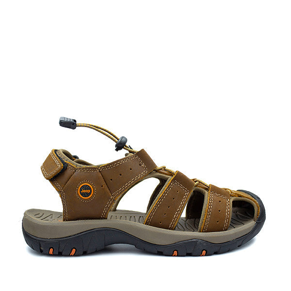 A brown Jeep Trackhwack closed sandal with adjustable straps and a trail-rated outsole.