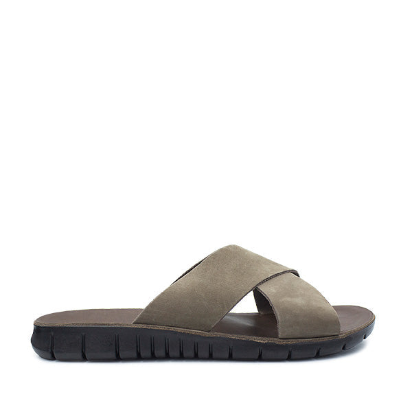 Brown sandal with a visible brand logo on a white background
