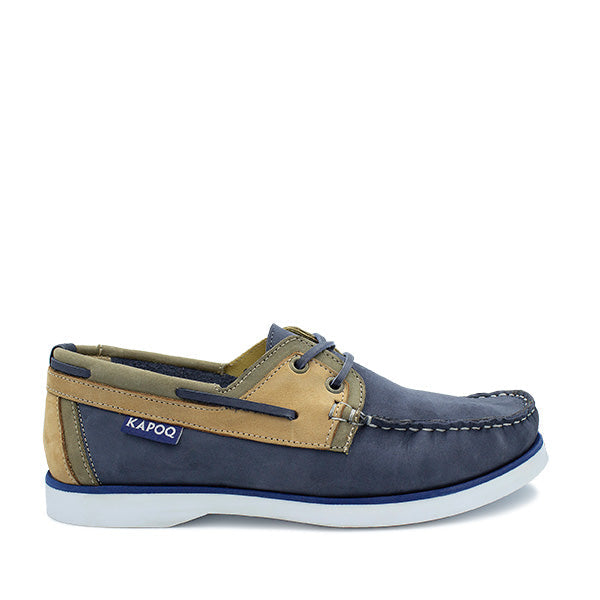 Blue and beige boat shoe with white sole.