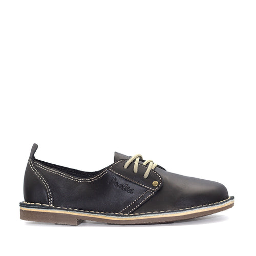 A Black-colored, low-top leather vellie with a lace-up closure and a flat sole.