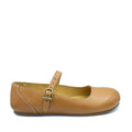 A tan colored Protea Kiewiet women's shoe with a buckle strap on the top.