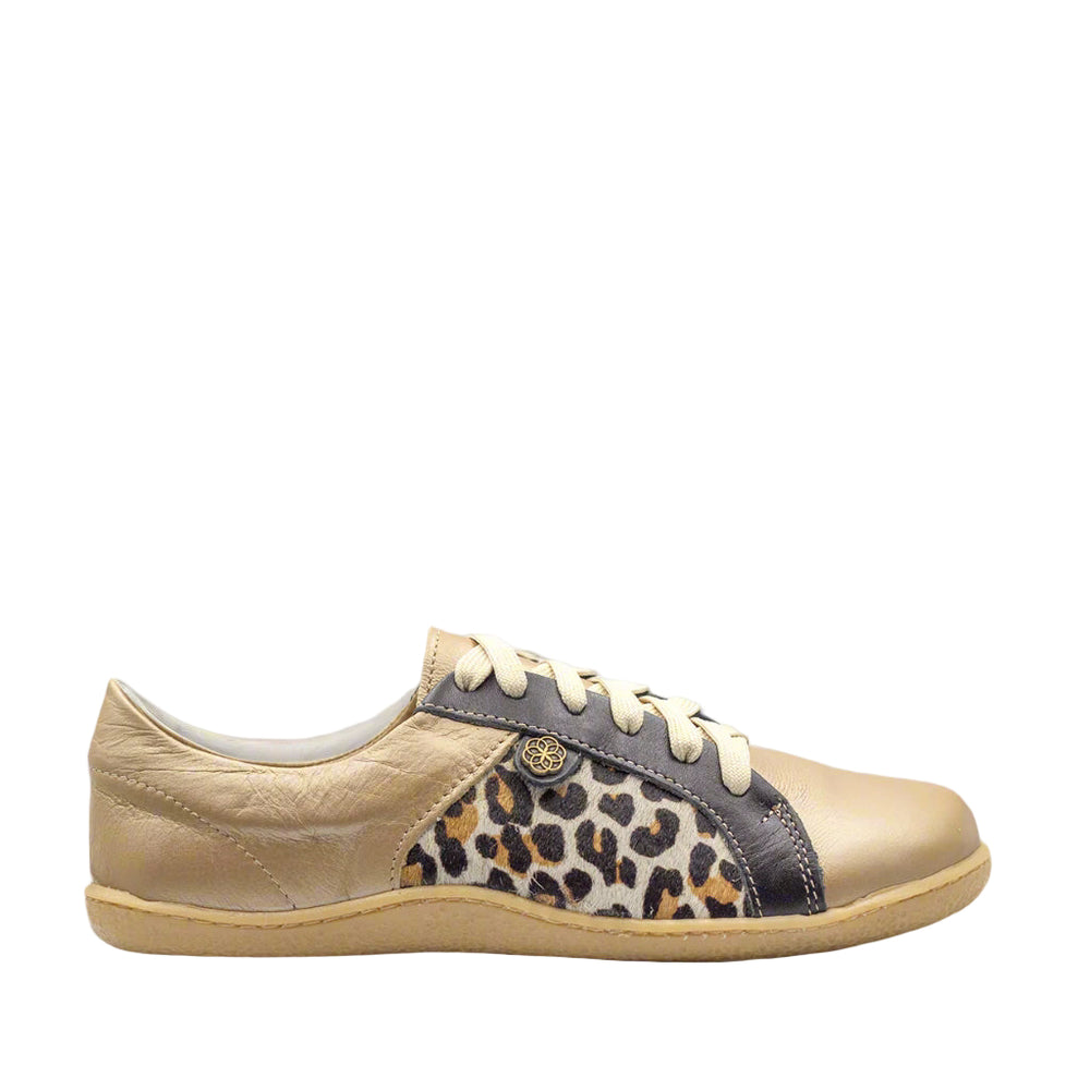 Beige sneaker with leopard print accents on a white background, featuring Vellie Boutique logo.