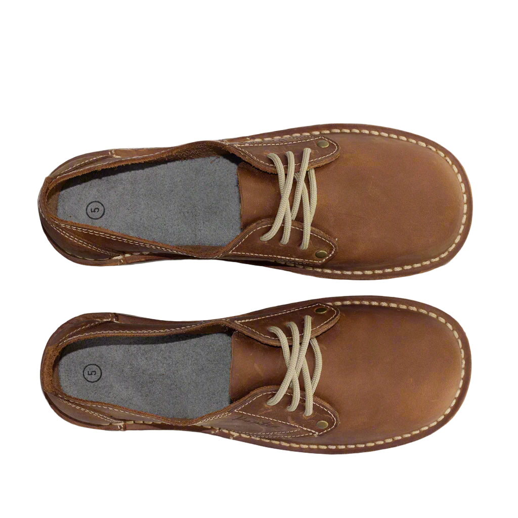 
                  
                    Brown leather shoes with white laces. Bruin leerskoene met wit veters
                  
                