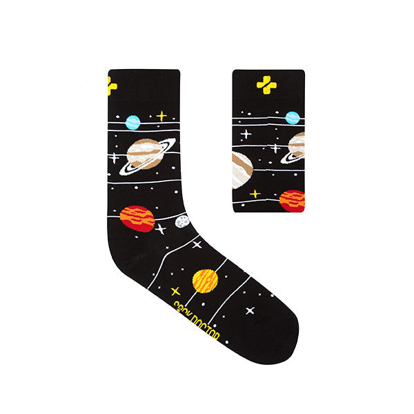 A pair of black socks with a space-themed pattern, including illustrations of planets and stars.