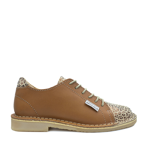 A women's Suikerbossie vellie shoe with a tan color and leopard print pattern on the toe cap, featuring a lace-up closure.