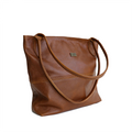 A brown, leather handbag with two shoulder straps and a front zipper pocket, set against a white background.