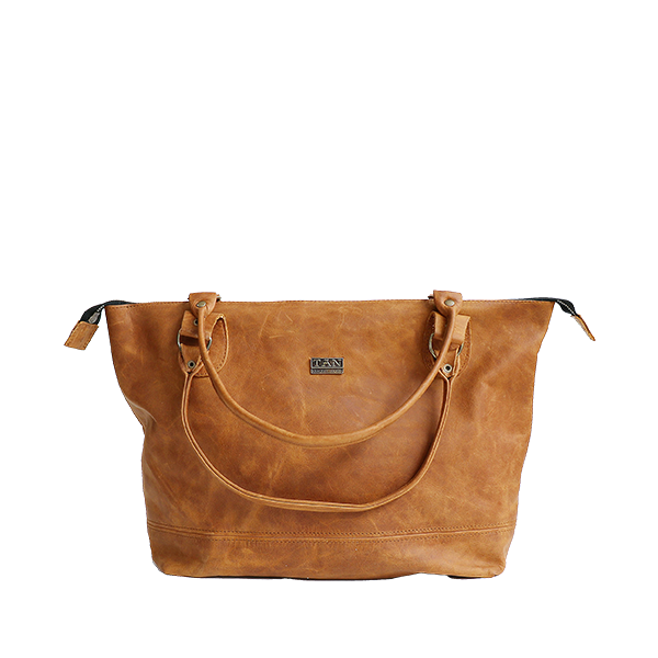 A toffee-colored, full-grain leather handbag with two shoulder straps and a label visible on the top.