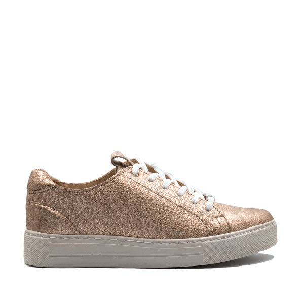 A rose gold Angelsoft Cindy Lace-Up Leather Sneaker with white laces.