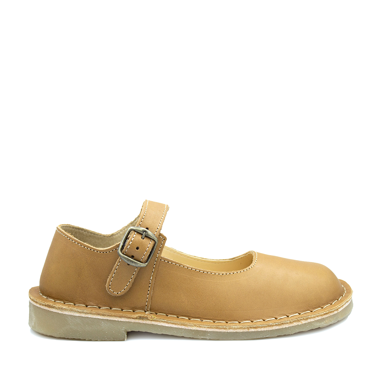 A tan-colored, handcrafted leather shoe with a buckle strap and low heel, made in South Africa.