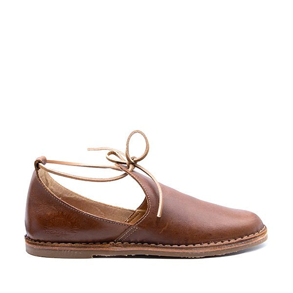 A brown leather shoe with a lace-up closure, designed for women. Handmade in South Africa