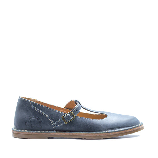 A single navy-colored leather shoe with a buckle closure, designed for women.