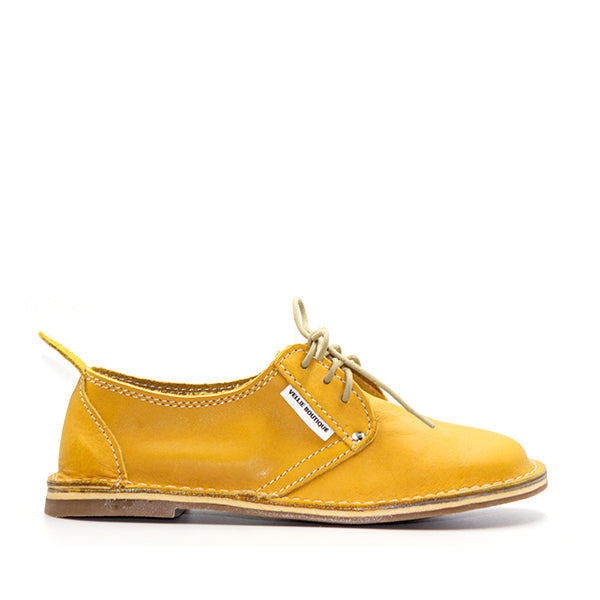 A yellow Protea Vellie shoe with lace-up closure, crafted from premium leather. Handmade in South Africa