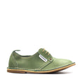 A green, handcrafted leather shoe with a slightly lifted heel and lace-up closure, made in South Africa.